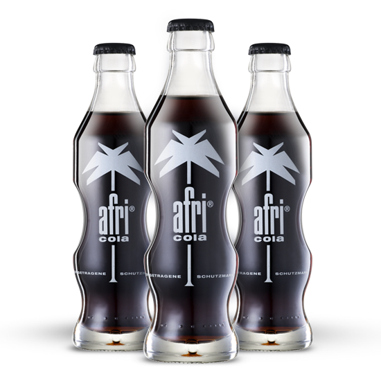 3 bottles of afri-Cola stand next to each other.